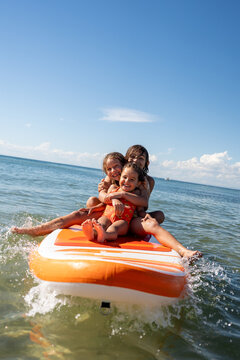 Kids having fun on a paddle board