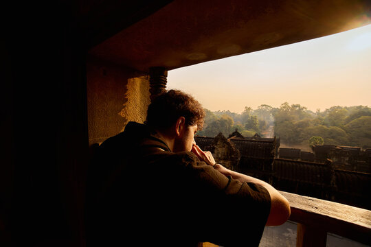 Man Contemplating Sunrise from Angkor Viewpoint