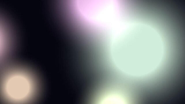 Blurry Lights Moving Against Dark Background.