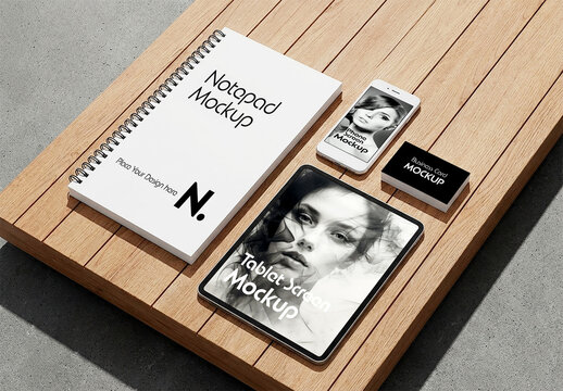 Minimalist Stationery Branding Mockup with Spiral Notepad Tablet and Smartphone on Wooden Surface