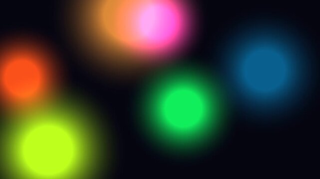 Blurry Multicolored Lights Against Black Background.