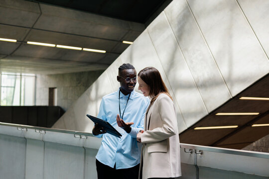 Team Reviewing Tablet Content Together