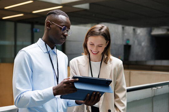 Business Team Reviewing Project on Tablet