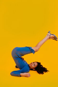 Flexible model lying on yellow background
