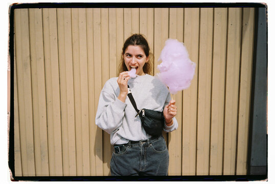 Film portrait of woman eating cotton candy