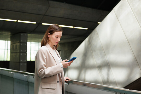 Elegant Businesswoman Reading Phone Message