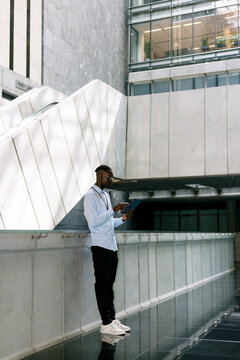 Businessman Using Tablet in Modern Building