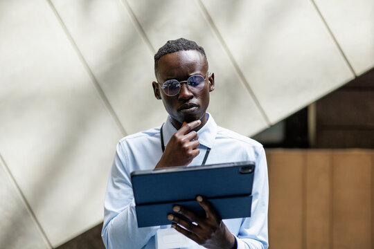 Business Professional Man Focused on Digital Tablet