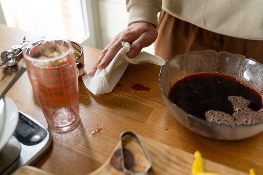 Wiping wine spill countertop