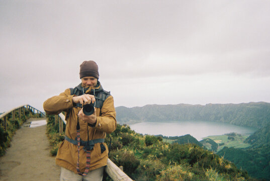 Man taking landscape photo