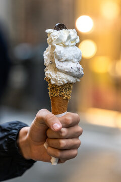 Hand Holding Gelato Cone with Whipped Cream