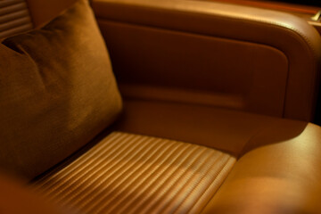 Fototapeta premium Luxurious jet interior. Premium cabin with wood accents and leather seats. Exclusive onboard environment featuring refined furnishings and practical amenities for executive travel