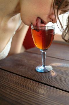 woman tries red cocktail