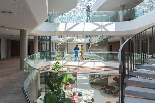 People In Modern Office Atrium