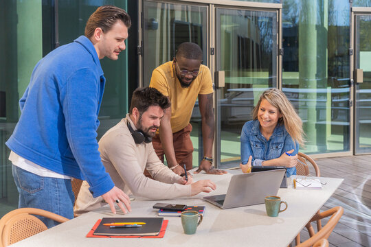 Outdoor Team Collaboration With Laptop