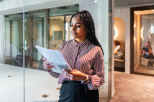 Focused Businesswoman Reviewing Documents