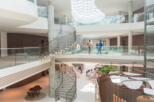 Modern Coworking Atrium With Spiral Staircase