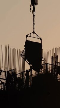 Heavy construction crane lifting material at Kai Tak Sports Park.