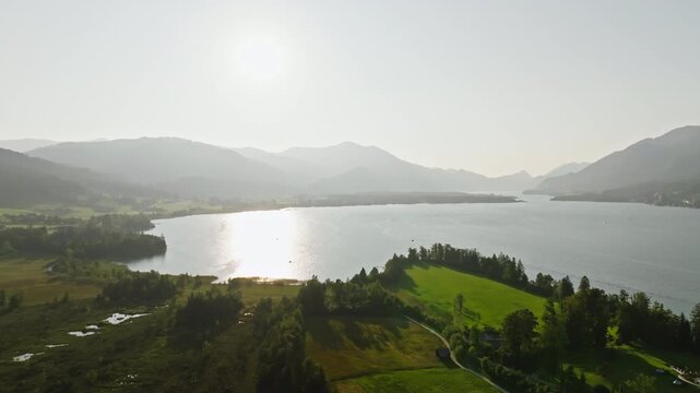 Aerial view landscape Wolfgangsee Austria. Sunset over the lake in the Alpine mountains, tourist Europe.