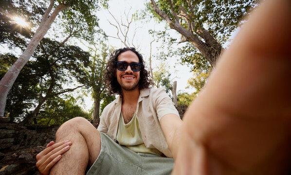 Man Taking a Selfie at Forest Temple in Siem Reap