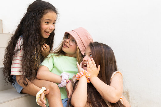 Kids play sharing secrets
