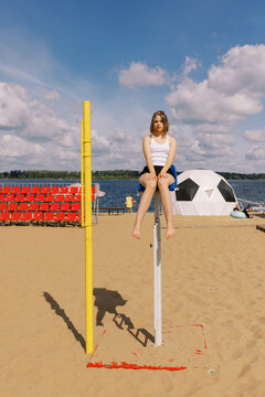 Young Woman Relaxing on referee Chair at Sunny Beach