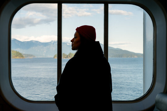 Young Woman Gazing Through Ferry Window &ndash; Serene Journey Across BC