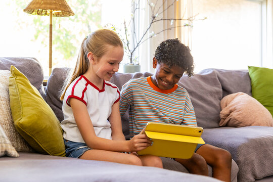 Children stream video tablet computer at home 