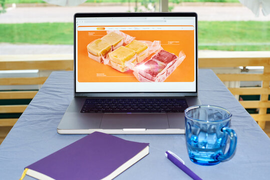 Laptop with frozen soup selection on screen on table during daytime