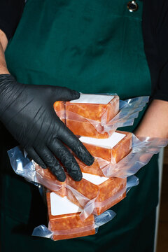 Person holds several packaged food items