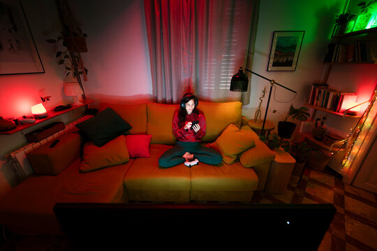 Gamer using phone during gaming break