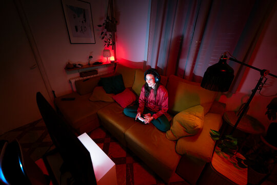 Woman enjoying gaming night at home