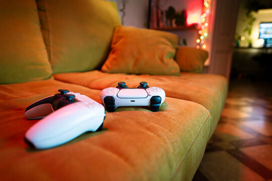Two console controllers on couch
