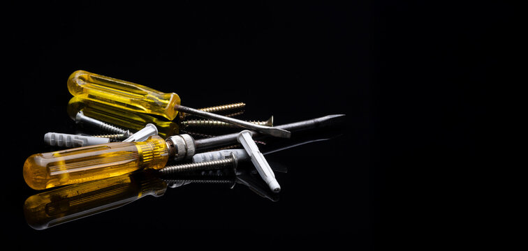 Screwdrivers with different screws and screw anchors  for home improvement and repairs