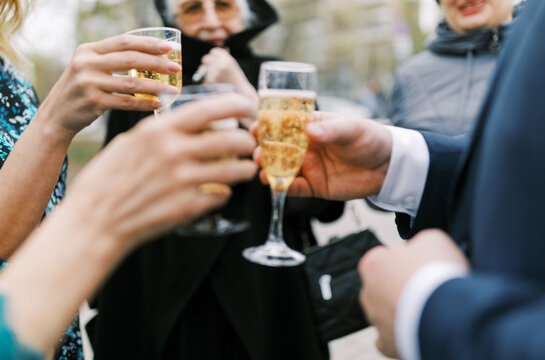 Friends Toasting with Champagne During Outdoor Celebration