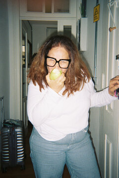 Funny Woman biting apple 
