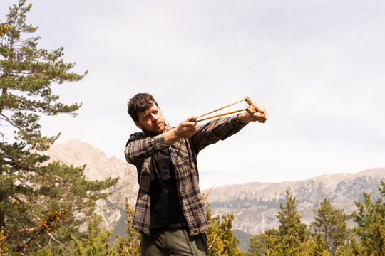  Man using slingshot