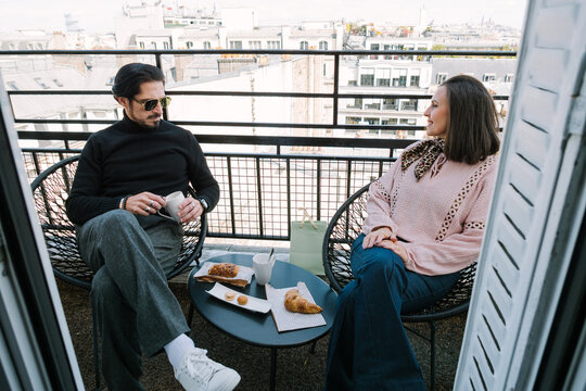 Couple sitting on hotel terrace