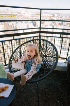 Toddler eating macarons