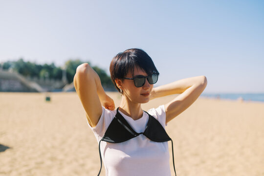 young woman with short hairs enjoying the summer day