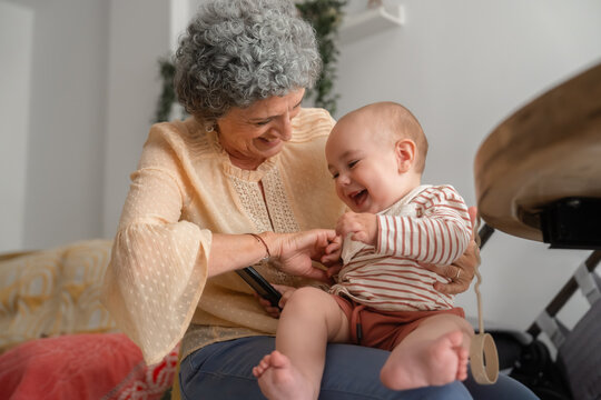 Grandmother tickling her grandson