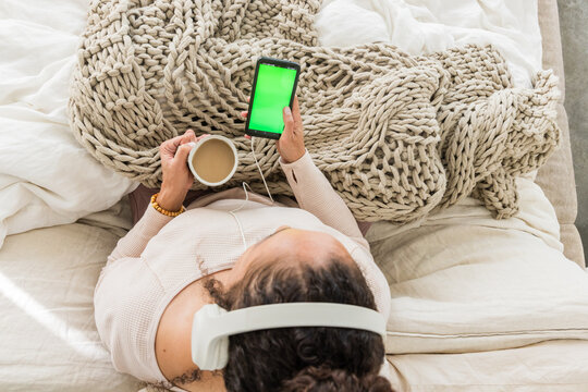 Woman Relaxing at Home with Phone