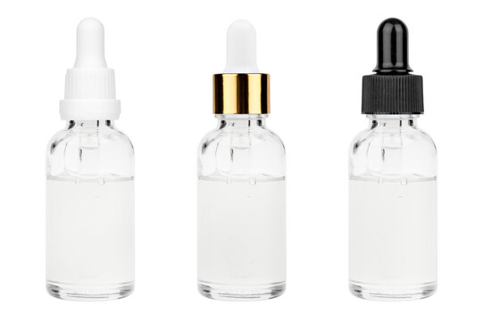 Glass bottle with cuticle oil and facial serum isolated on white background