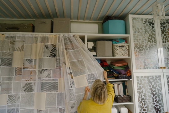 Woman at home near the closet