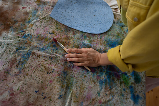 Hand of artist with brush