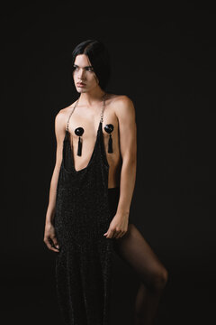 Nonbinary model wearing black dress as collar 