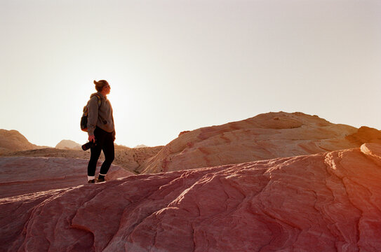 Hiker with camera in mountains