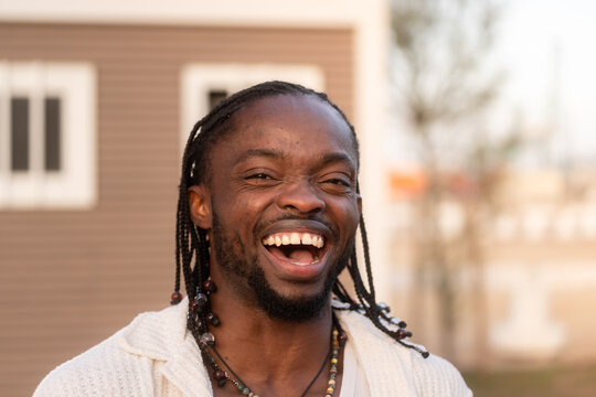 man smiling and showing teeth