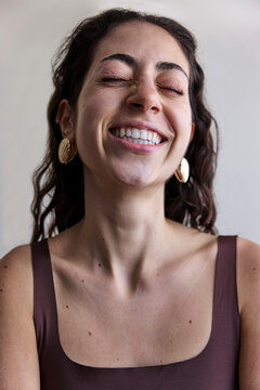 Young model with a seashell golden earring