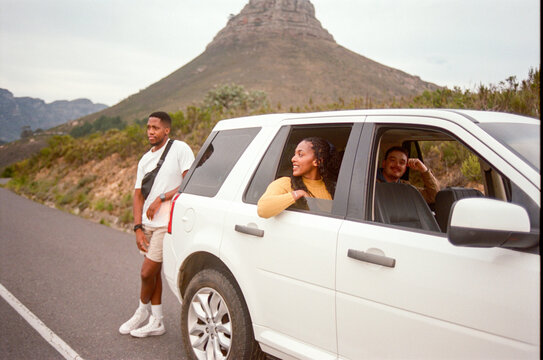 Posing Outside a Parked Car